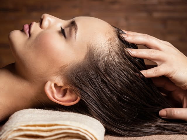 Hair care tips scalp massage woman