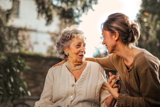 Honour Your Mother: The Way You Treat Her Reflects in Your Life 4 Elderly woman and adult daughter share a joyful, affectionate moment in a sunny garden.