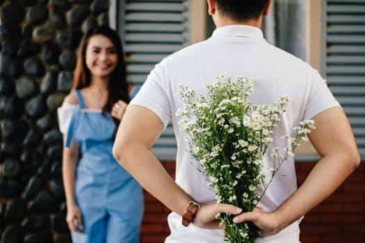 The Powerful Link Between Relationships and Mental Health 4 A man surprises his partner with flowers behind his back, symbolizing love and romance.