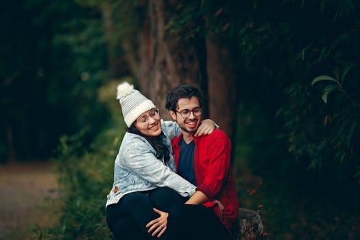Building a Strong Marriage | Key Principles for a Lasting Relationship 5 Happy couple sitting together in a green park, enjoying a joyful moment filled with love and affection.