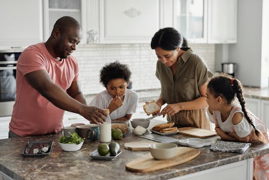 Realizing Parental Love Too Late: Why We Understand Only After It’s Gone 3 A joyful family enjoys preparing a healthy meal together in their modern kitchen.