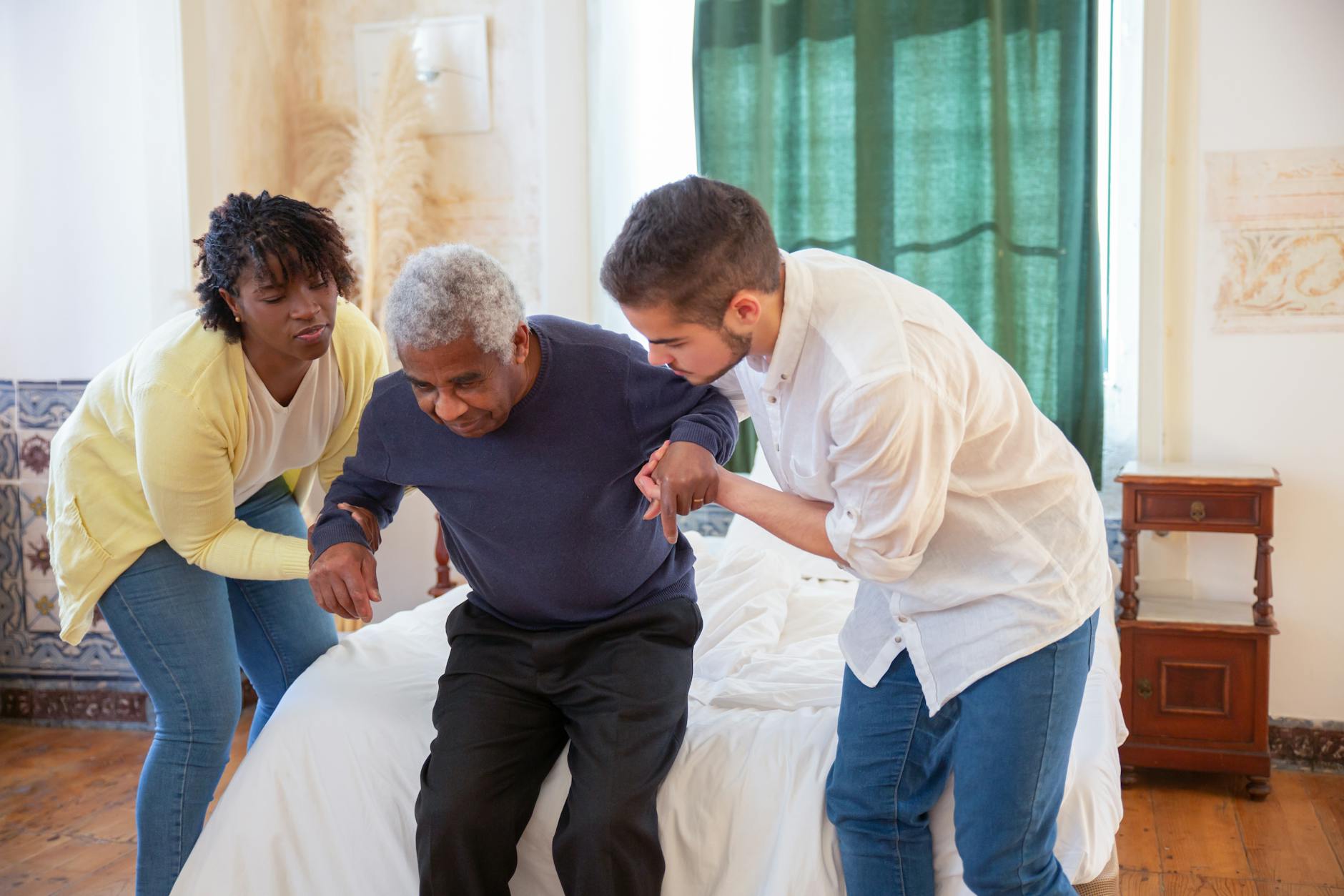 30 Powerful Ways to Show Gratitude to Parents 4 a man and a woman assisting an elderly man in standing