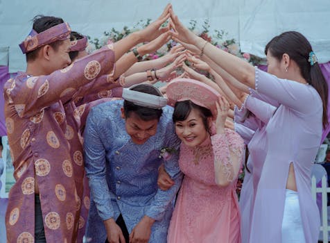 Common Things That Cause Regret in Old Age and How to Avoid Them 3 Happy Vietnamese couple celebrates their wedding with friends in traditional attire outdoors.