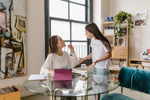 Common Things That Cause Regret in Old Age and How to Avoid Them 5 A mother and teenage daughter engage in a discussion at home, capturing family dynamics and emotions.
