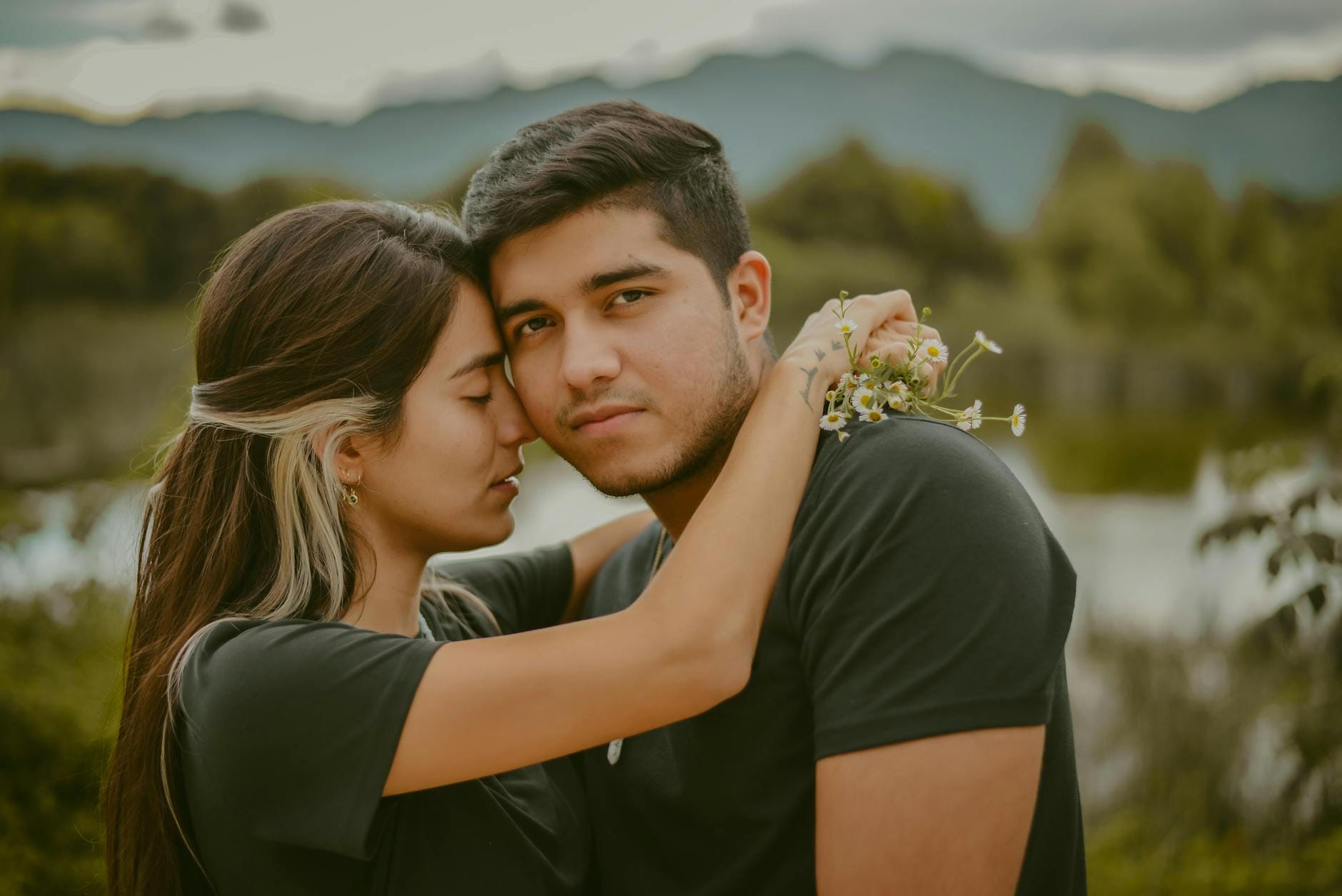 close up photo of woman holding on to a man