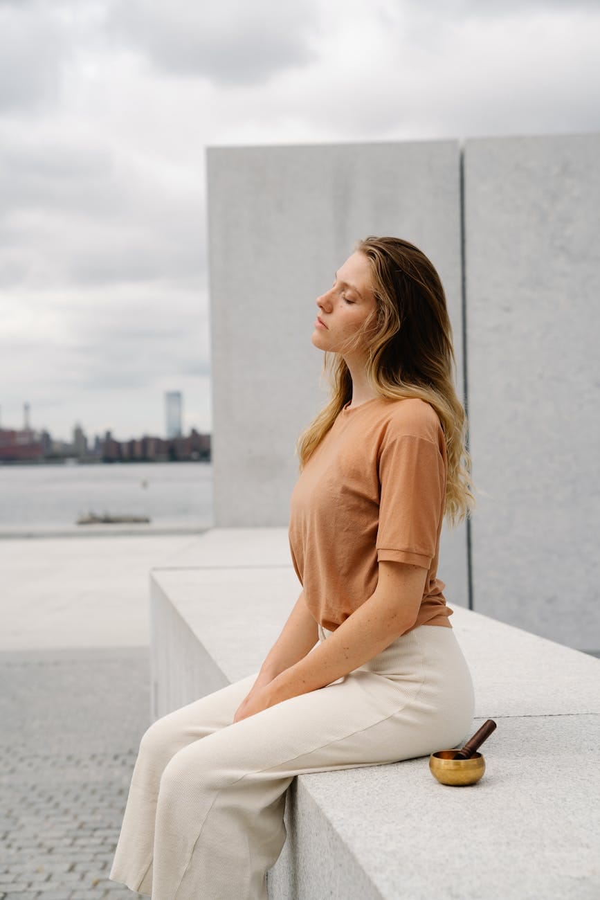 Finding Balance in Life: Why You Don’t Need to Understand Everything? 3 woman sitting in city relaxing with a singing bowl for meditation