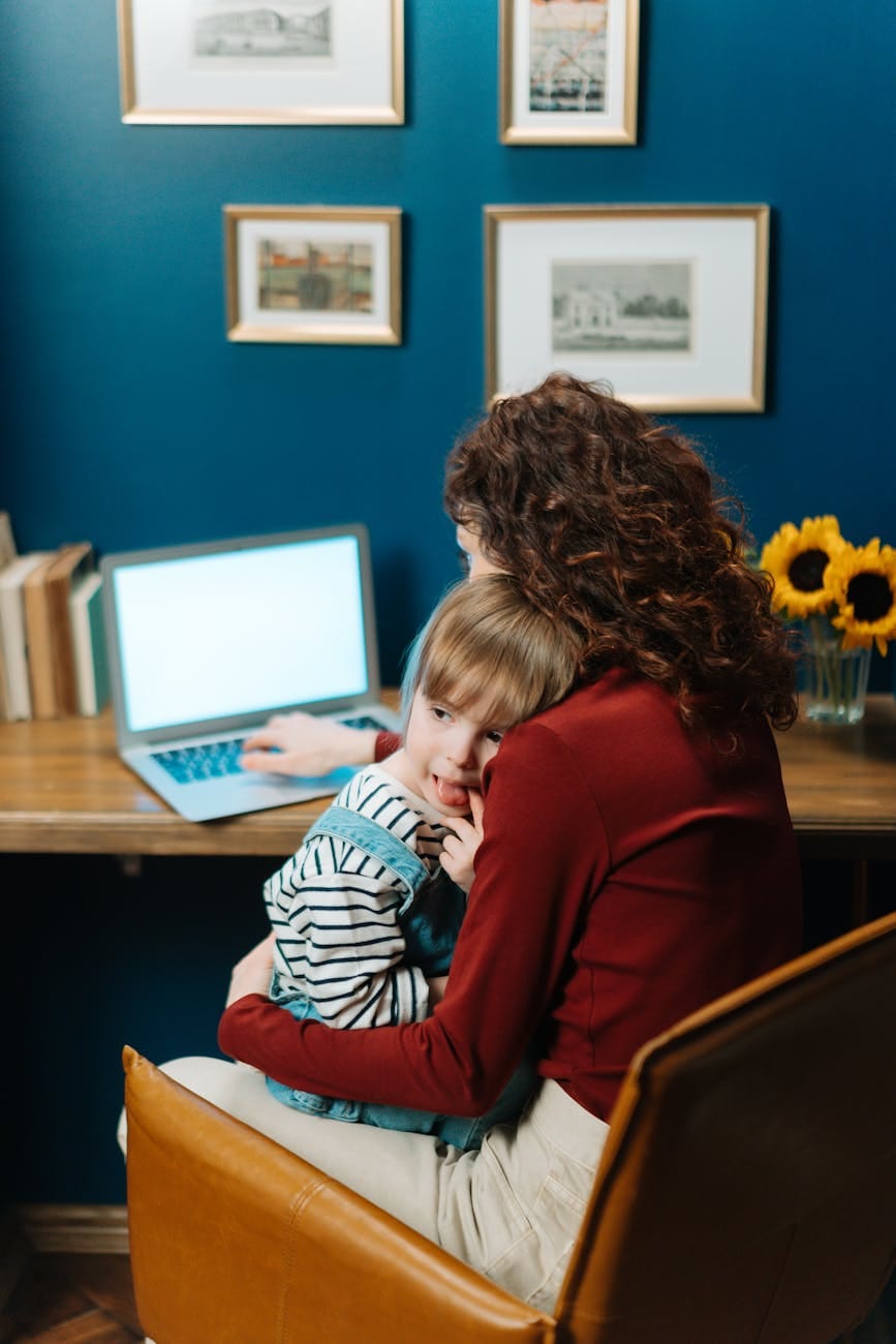 Time Management for Working Moms: Effective Tips to Balance Career and Home Responsibilities 3 a boy sitting to his mother
