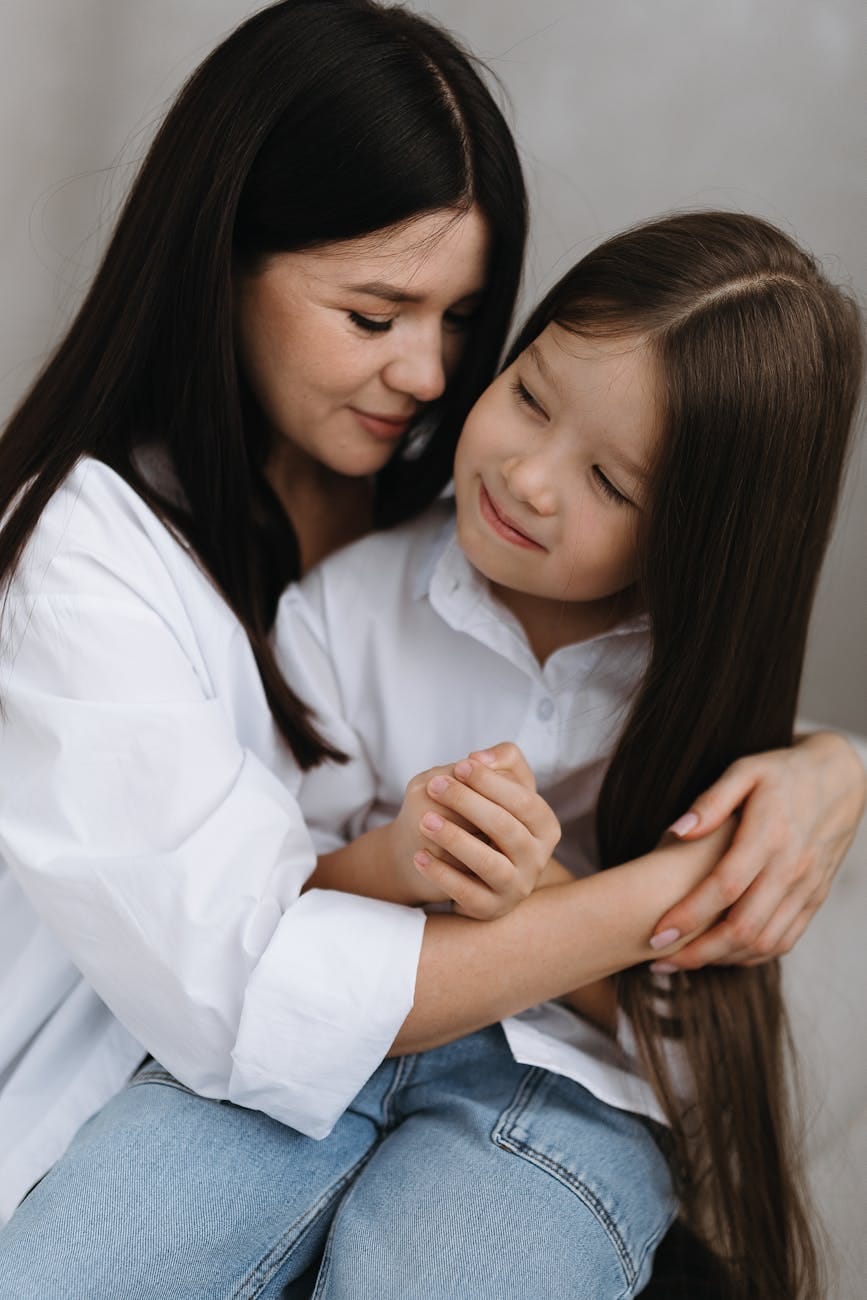 mother and daughter share tender moment