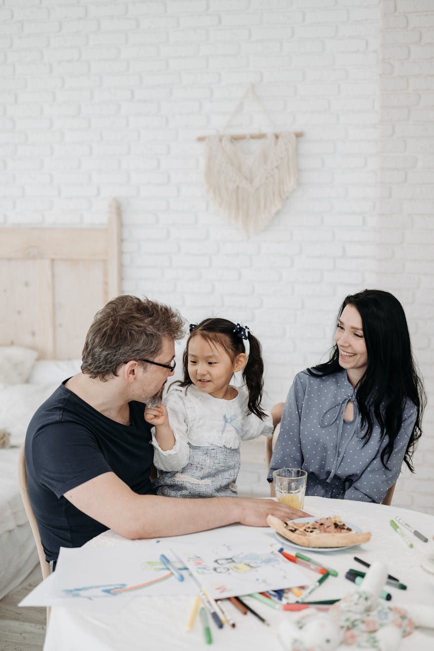 Effective Communication in Parenting: How to Build Stronger Connections 3 a man and woman having conversation with their daughter