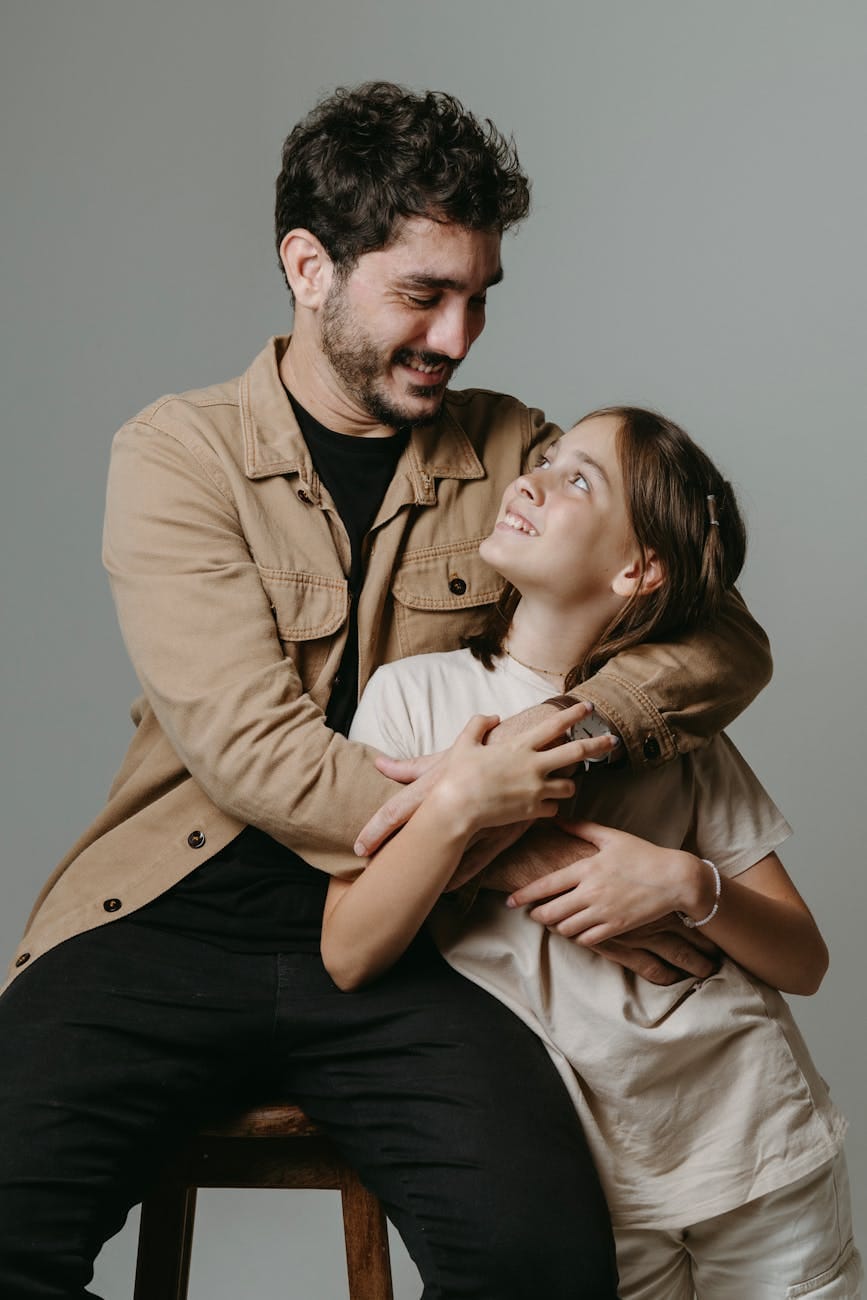 father hugging his daughter