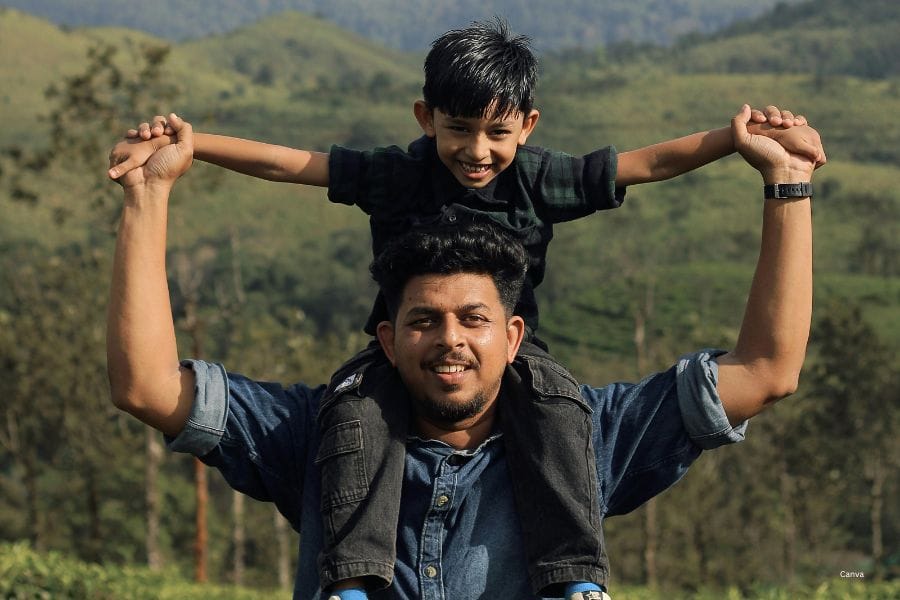 Raise Emotionally Secure Sons 4 Son sitting on the shoulders of father